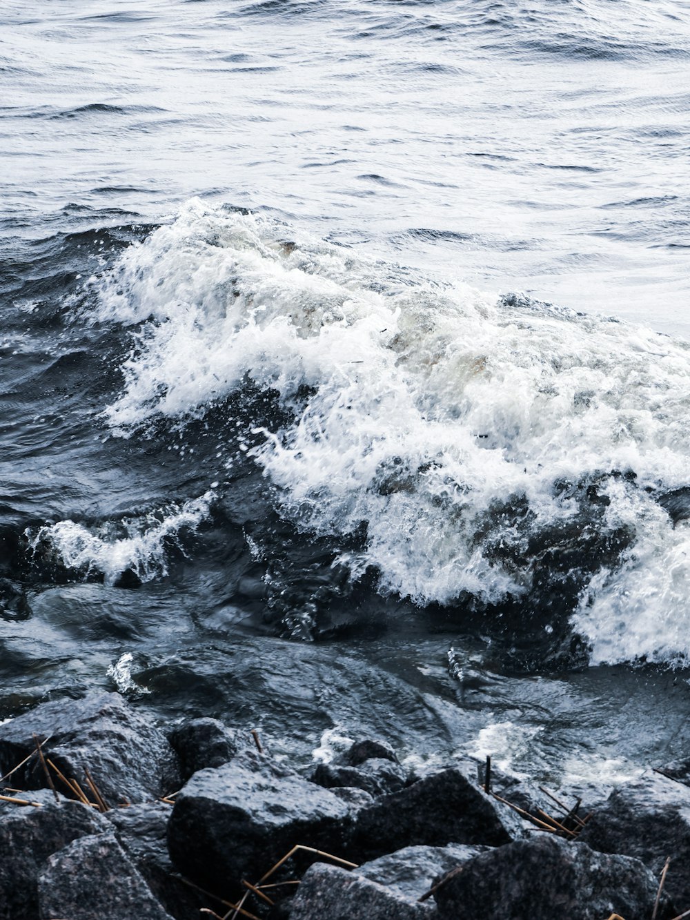 a person riding a surfboard on a wave in the ocean