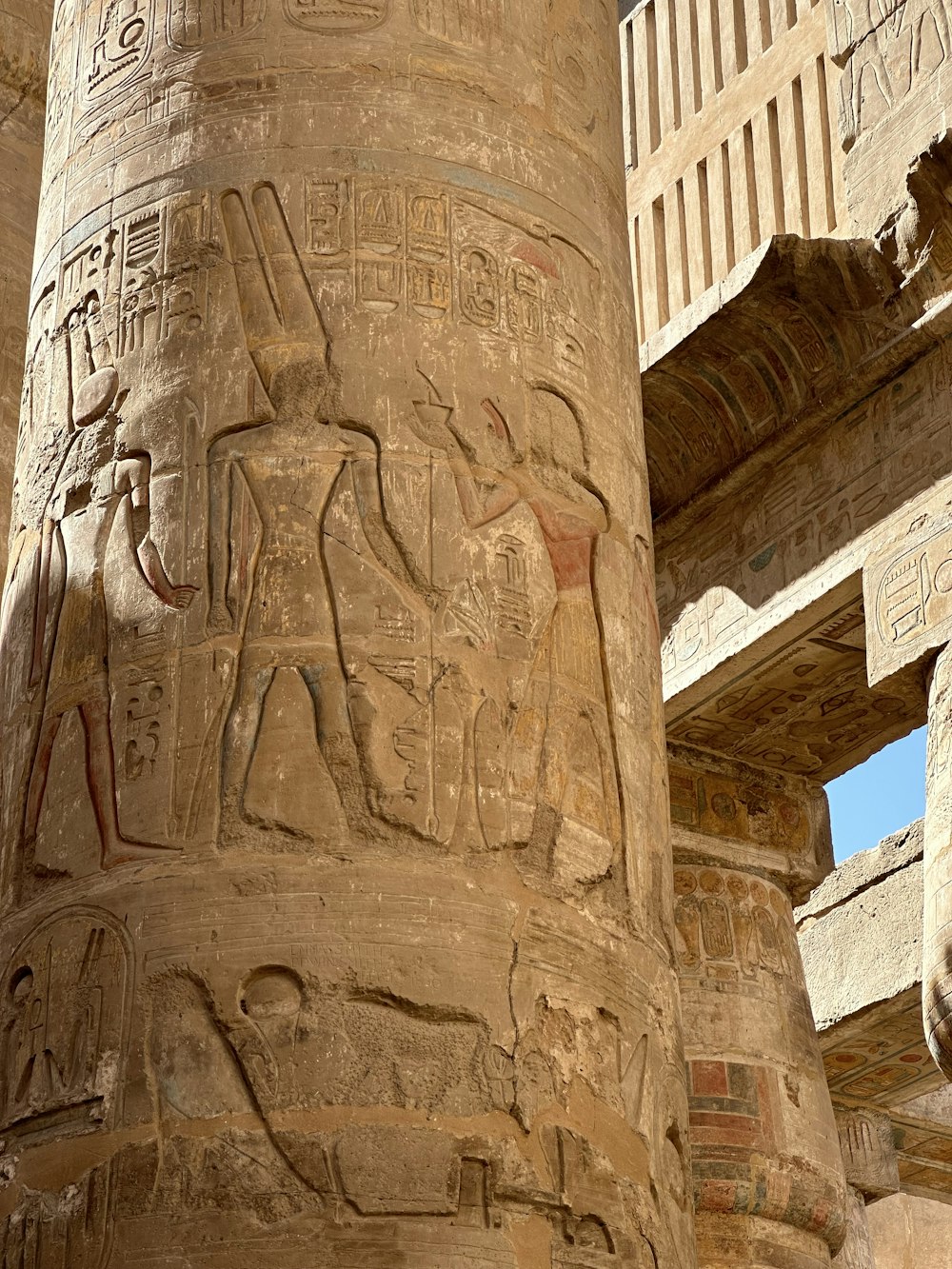 a close up of a pillar with carvings on it