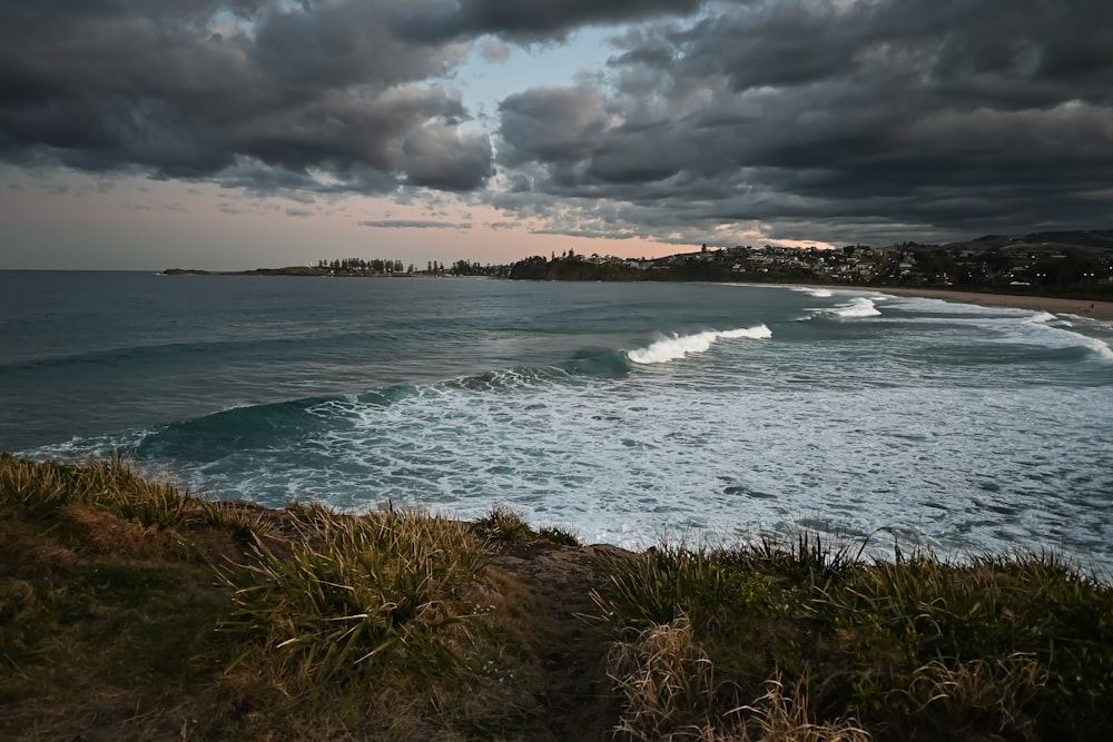 a view of a body of water under a cloudy sky