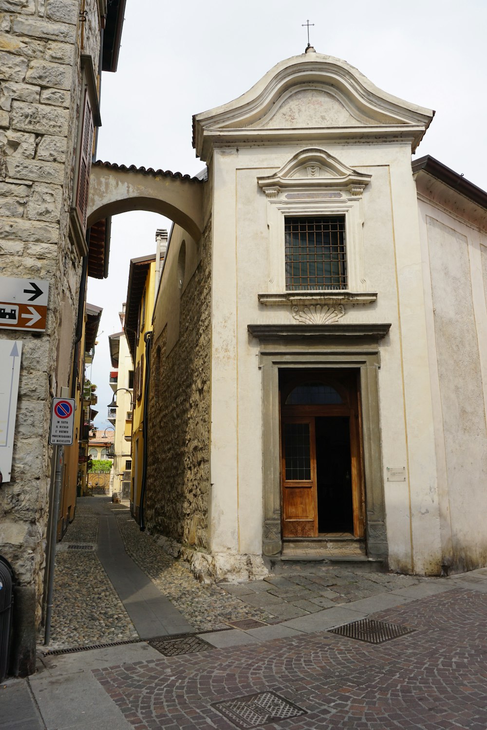 an old building with a door and a window