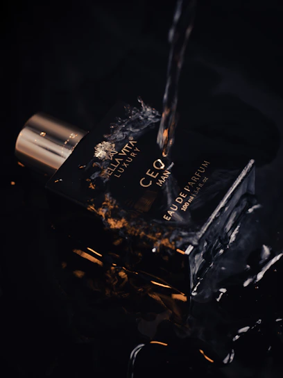 Behind-the-scenes photo of a modern perfume photoshoot with stylish casual clothing and creative team planning content.