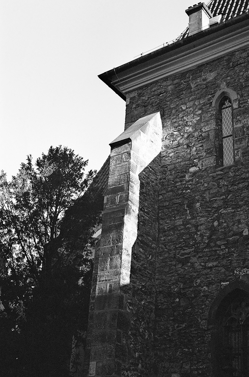 a black and white photo of an old church