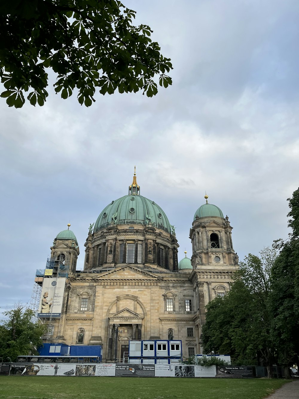 a large building with a green dome on top of it