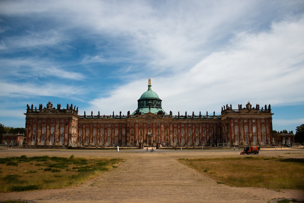 a large building with a green dome on top of it