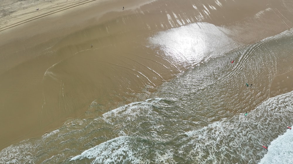 a person riding a surf board on a body of water