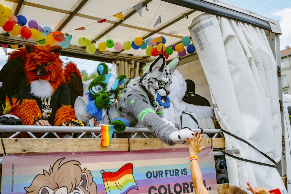 a group of people standing on top of a float