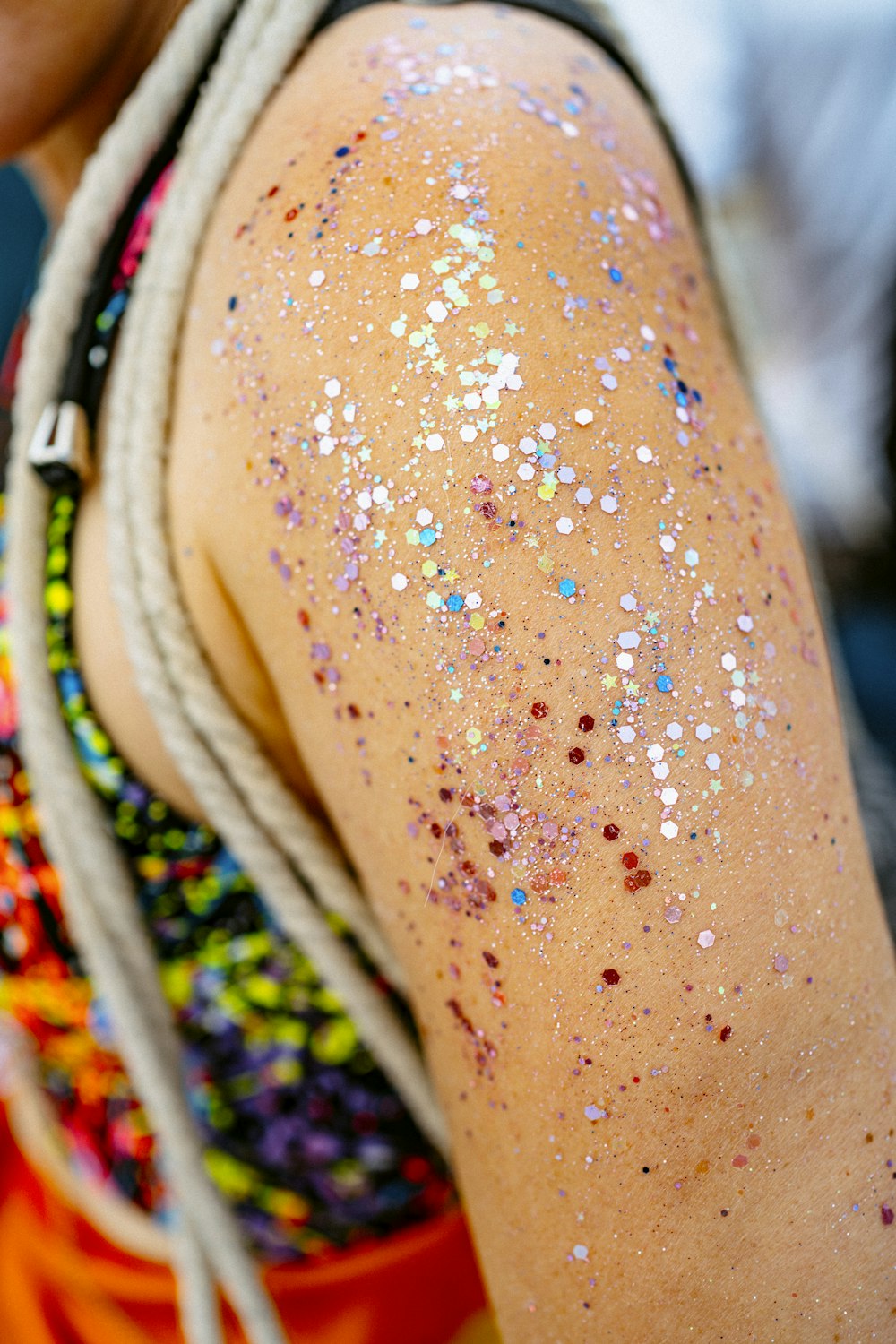 a woman with glitter on her body and braids