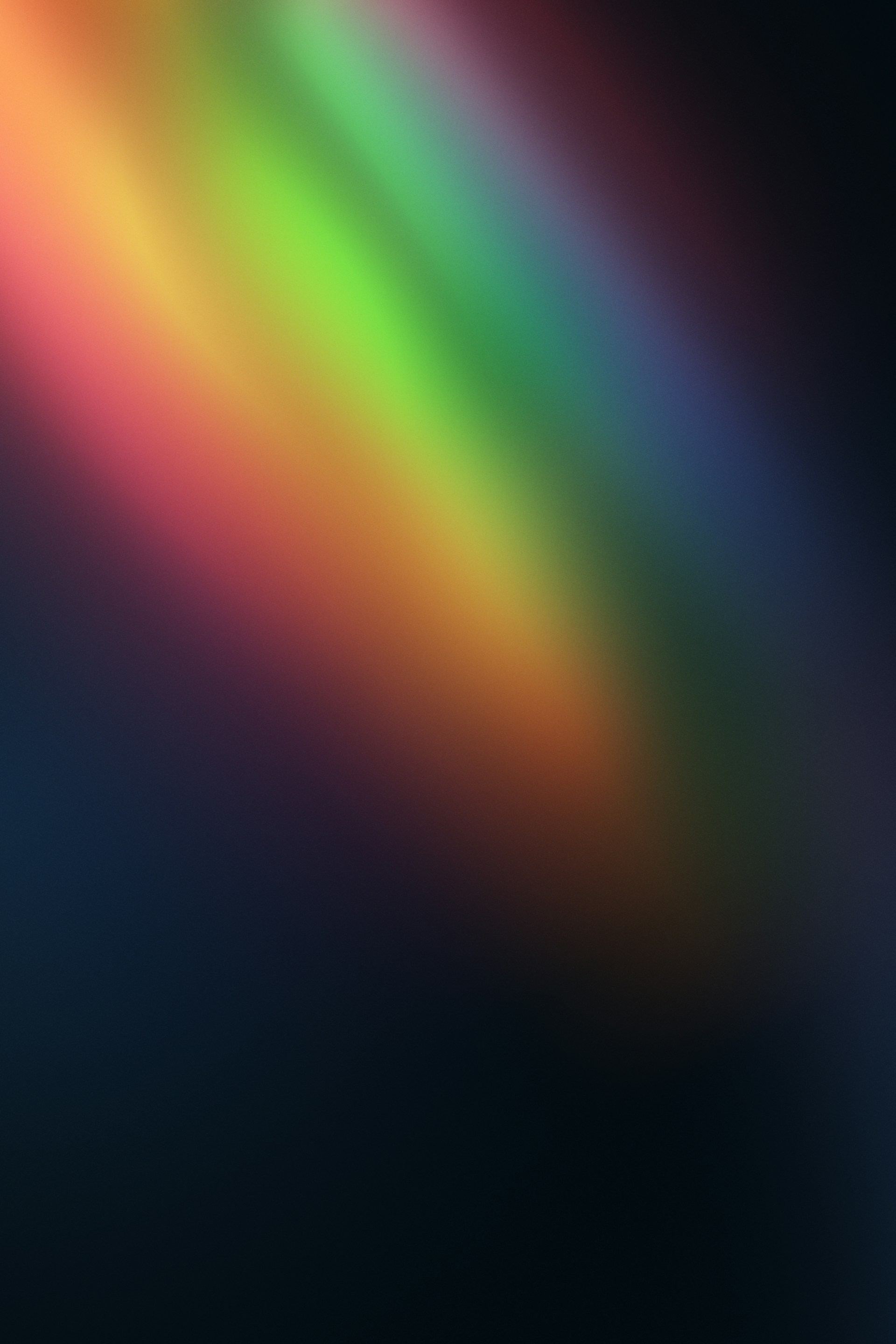 a blurry image of a rainbow colored object
