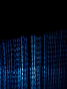 Abstract black and white image of digital data streams flowing.