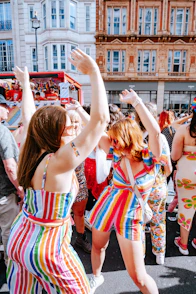 a group of people dancing in the street