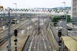 Railway infrastructure with bridges and tracks in an open area.