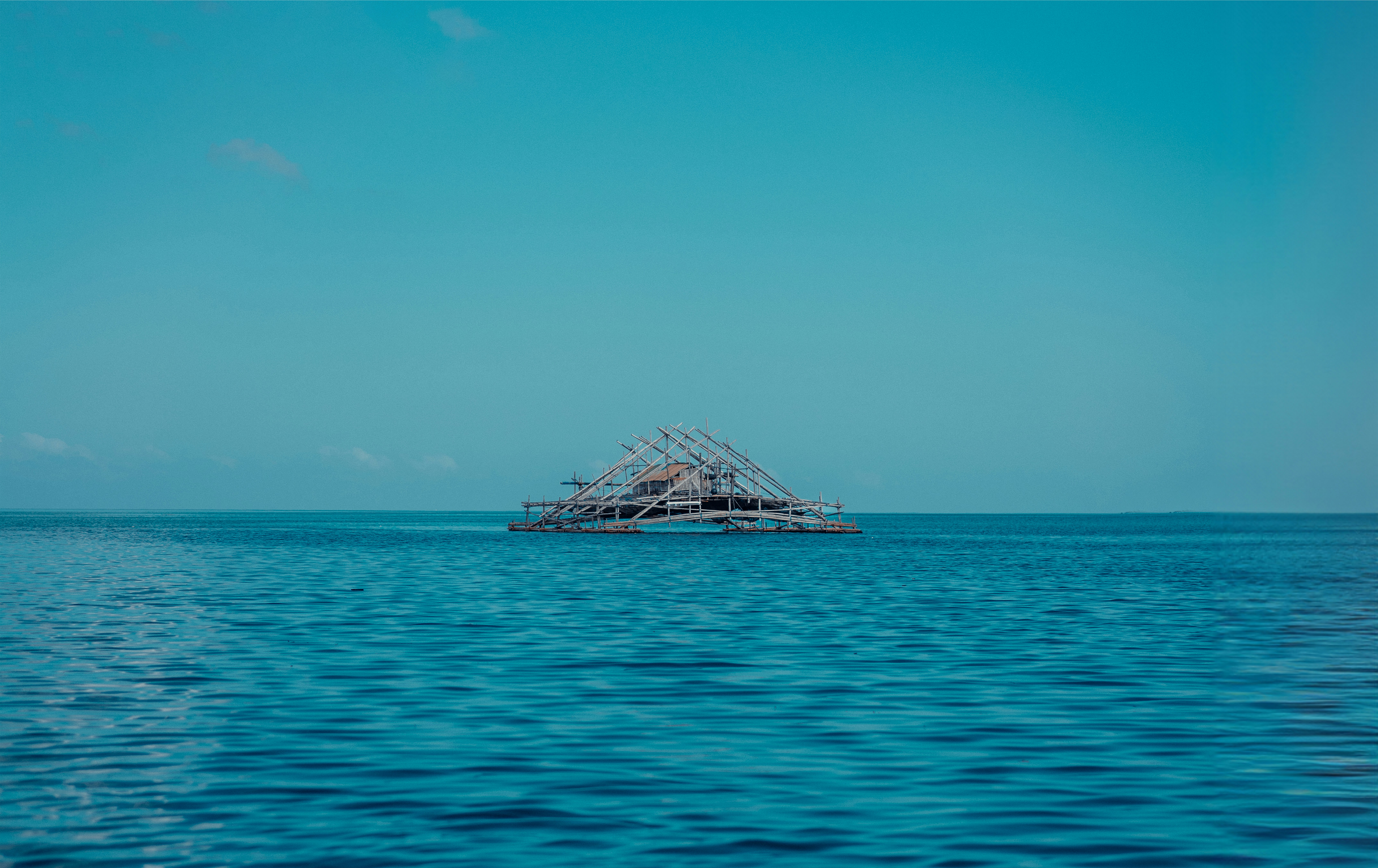 a boat floating on top of a large body of water