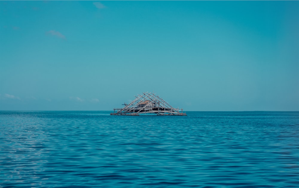 a boat floating on top of a large body of water