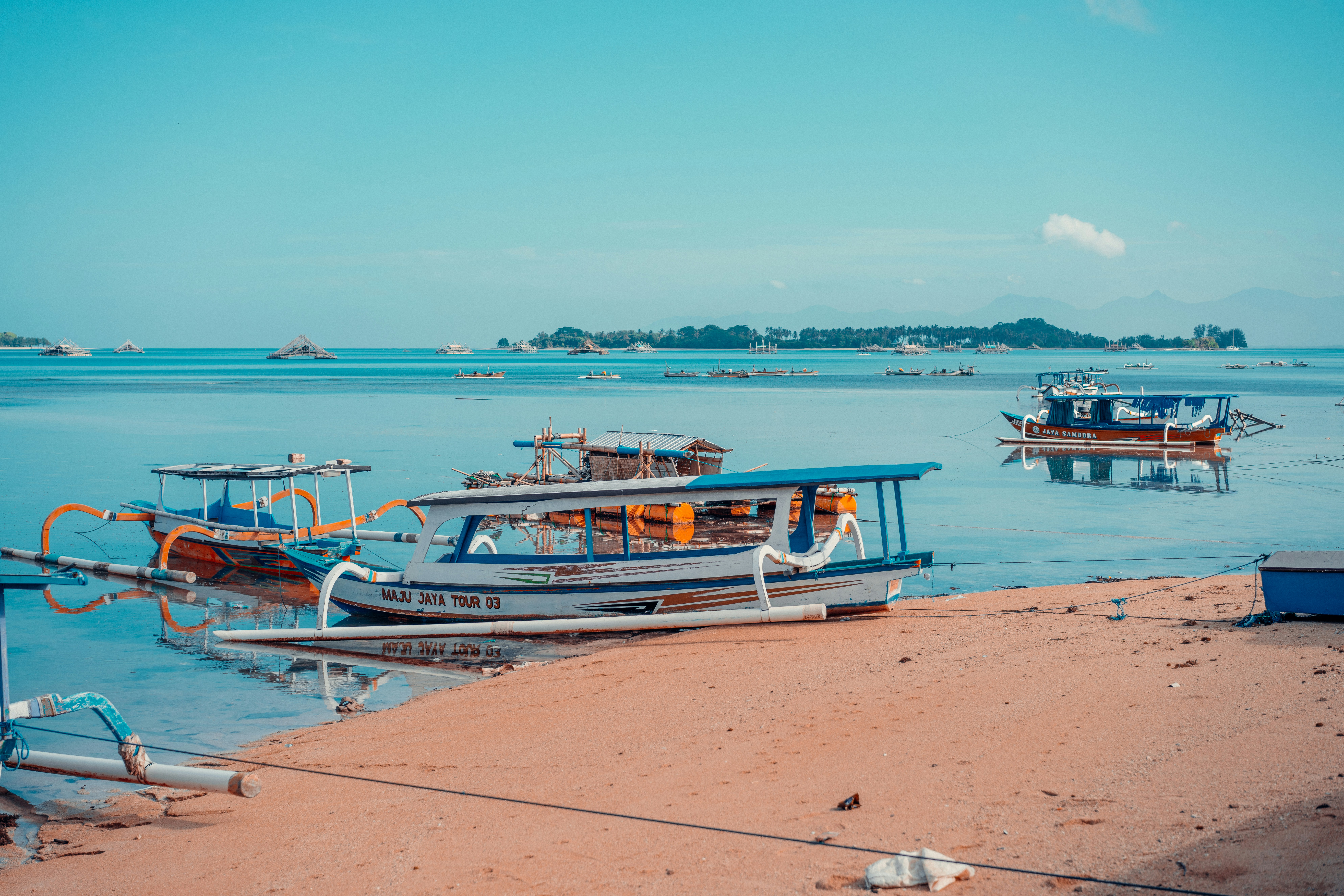 a group of boats that are sitting in the water