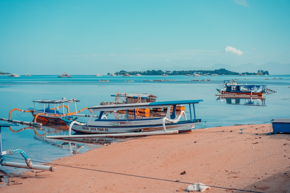 a group of boats that are sitting in the water