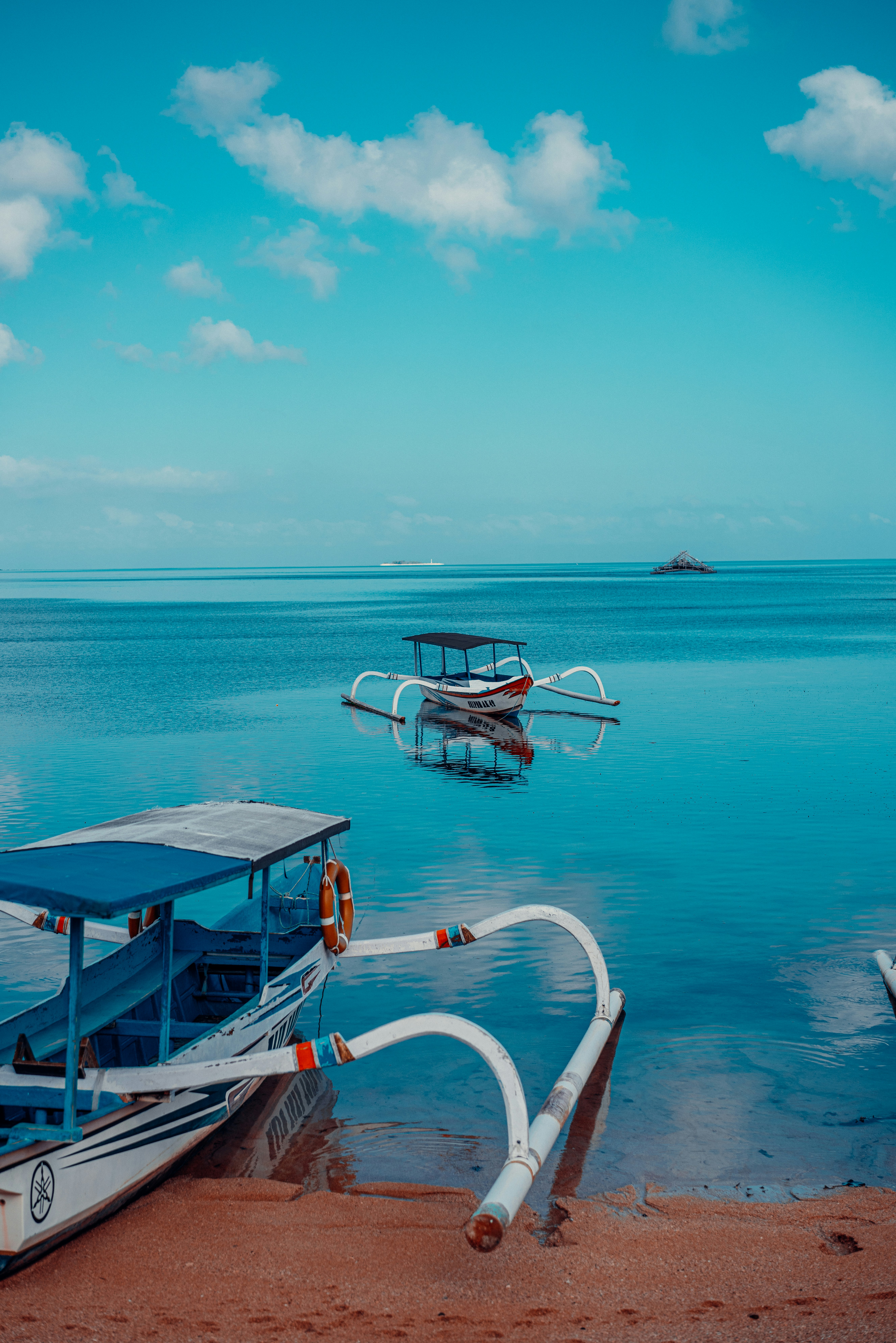 a couple of boats that are sitting in the water