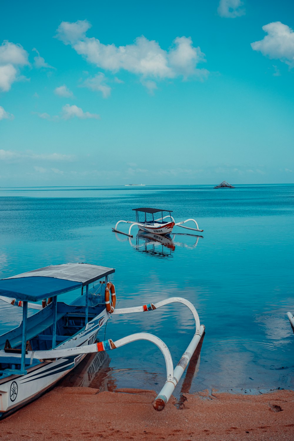 a couple of boats that are sitting in the water