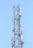 A tall metal communication tower with various antennas and equipment installed on it against a clear blue sky.