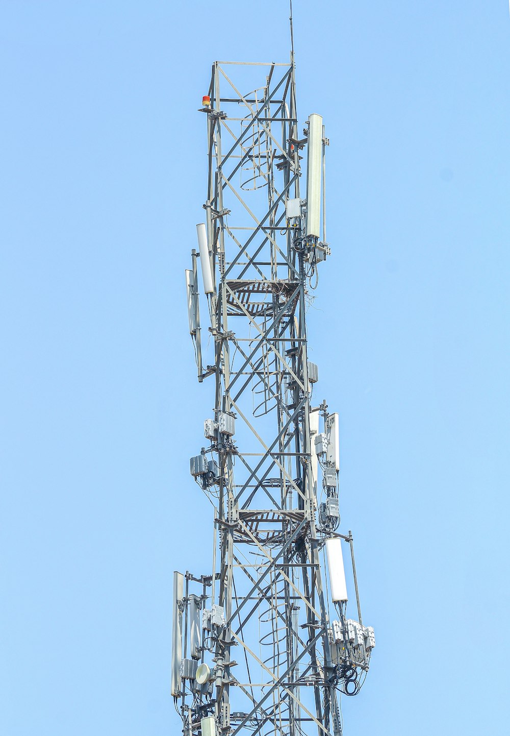 a very tall tower with lots of antennas on top of it