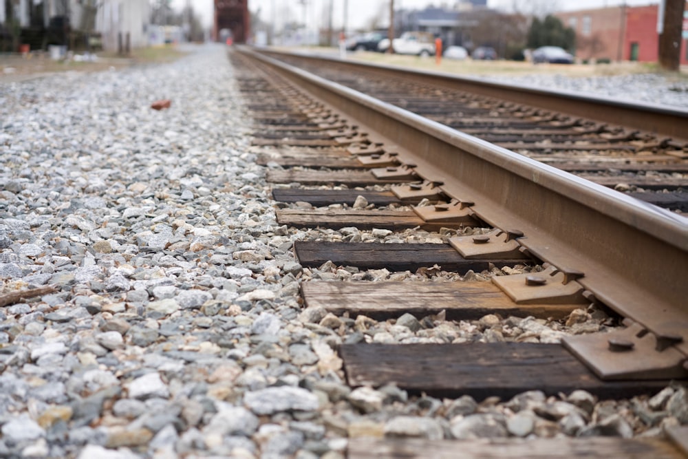 a close up of a train track with a building in the background