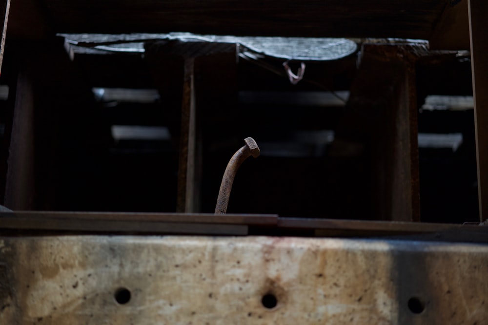 a piece of metal is in a wooden box