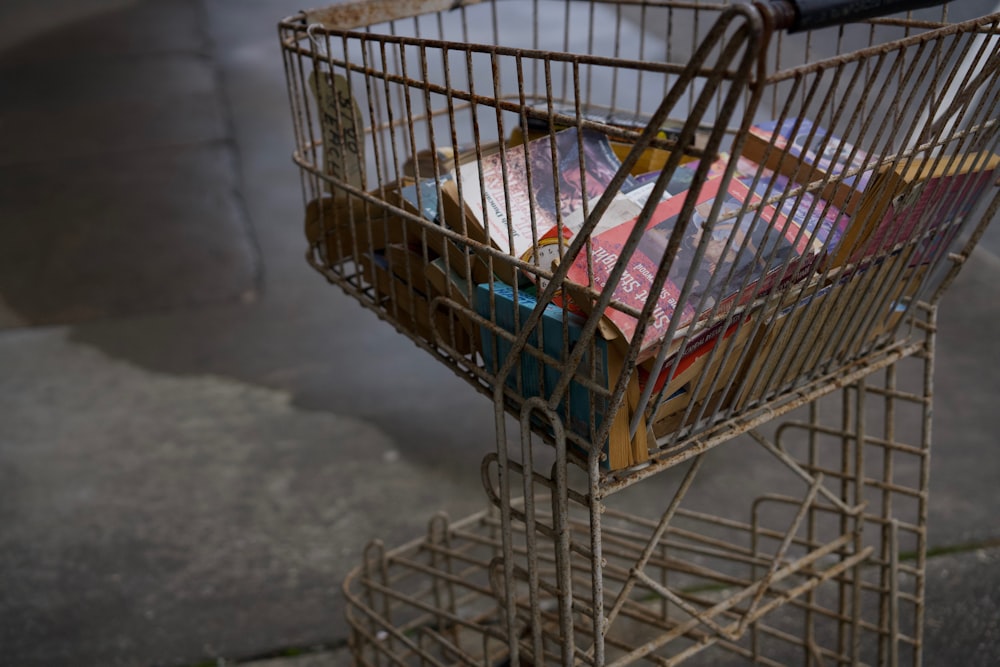 a shopping cart filled with lots of books