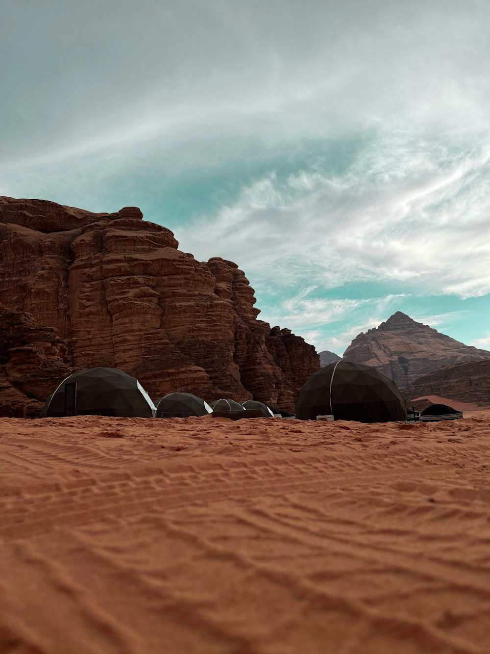 a group of tents set up in the desert
