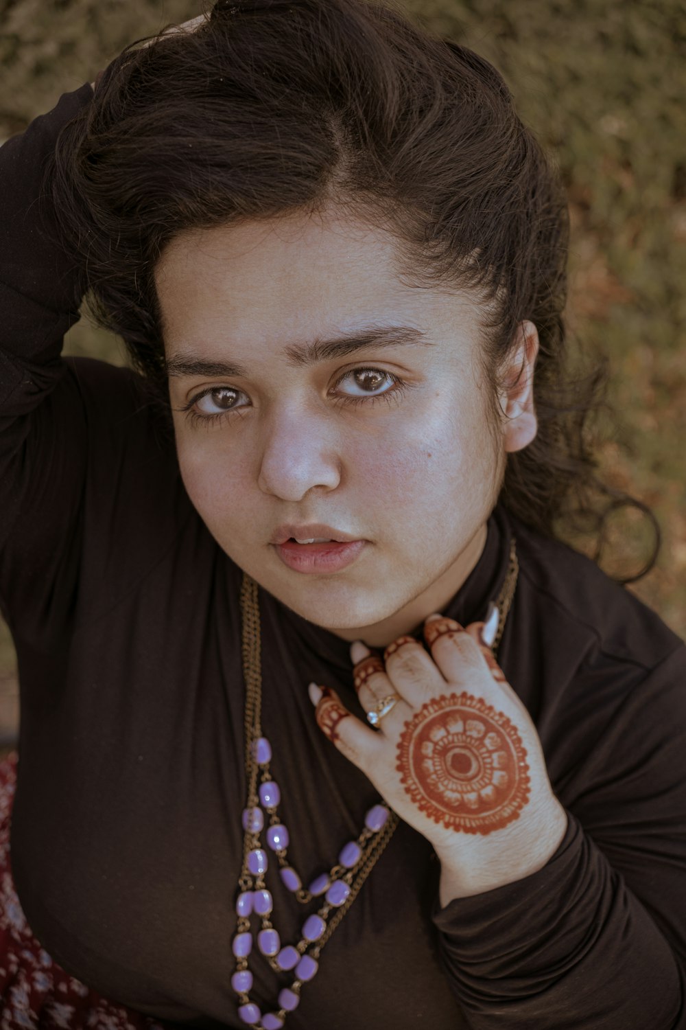 a woman with a henna on her hand