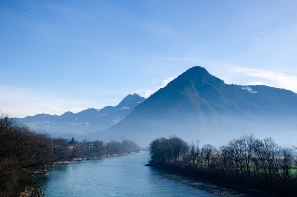 a river with a mountain in the background