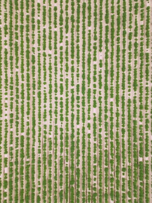 An aerial view of a neatly organized agricultural field with parallel rows of green crops planted in earthy, light-colored soil. The alignment and uniformity of the rows create a visually striking pattern.
