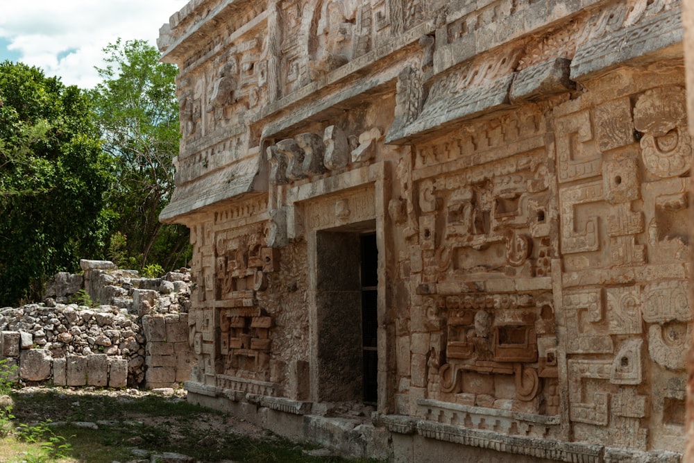 a stone building with carvings on the side of it