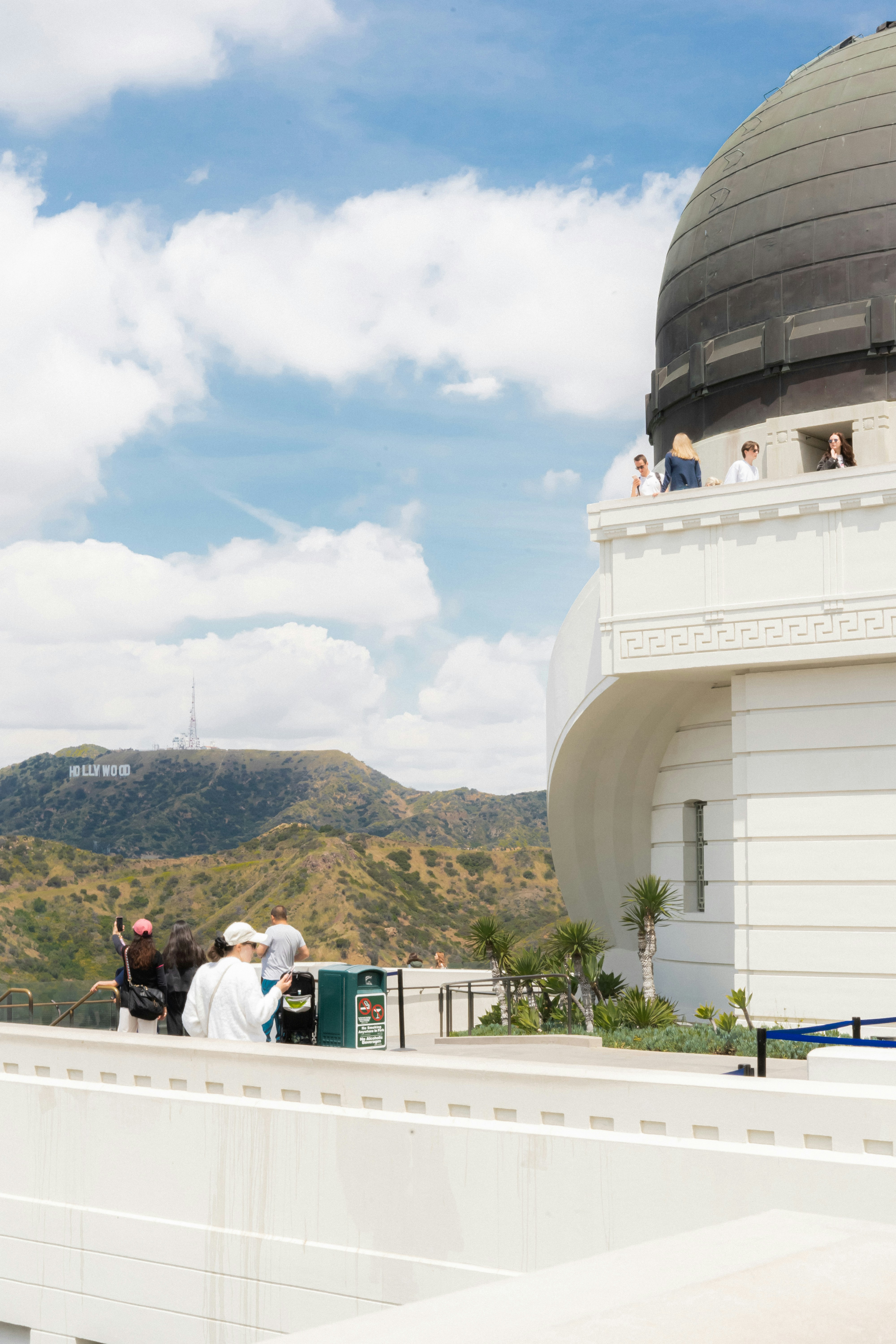 a group of people standing on top of a building
