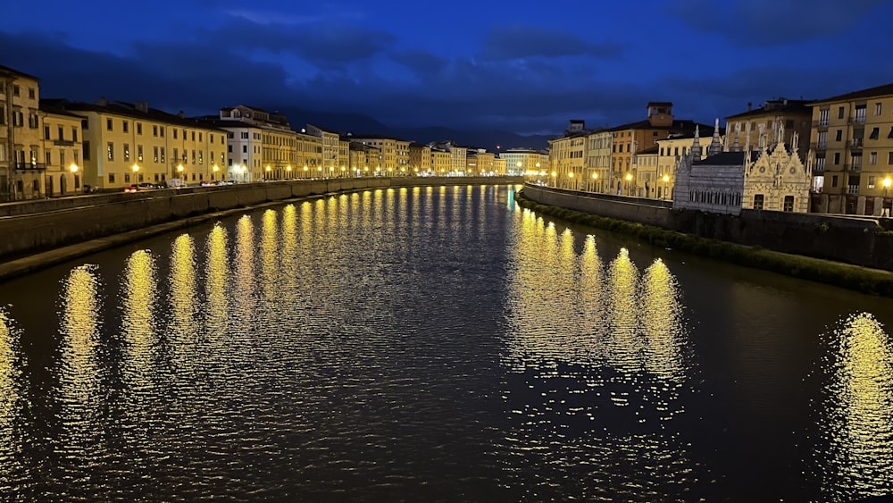 a river running through a city next to tall buildings