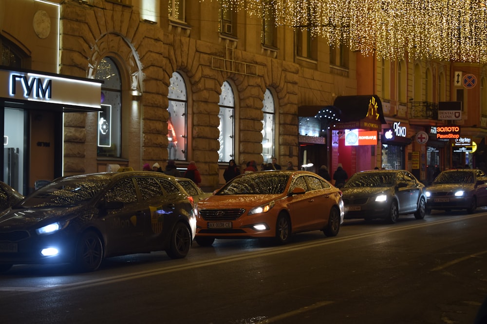 a group of cars parked on the side of a street