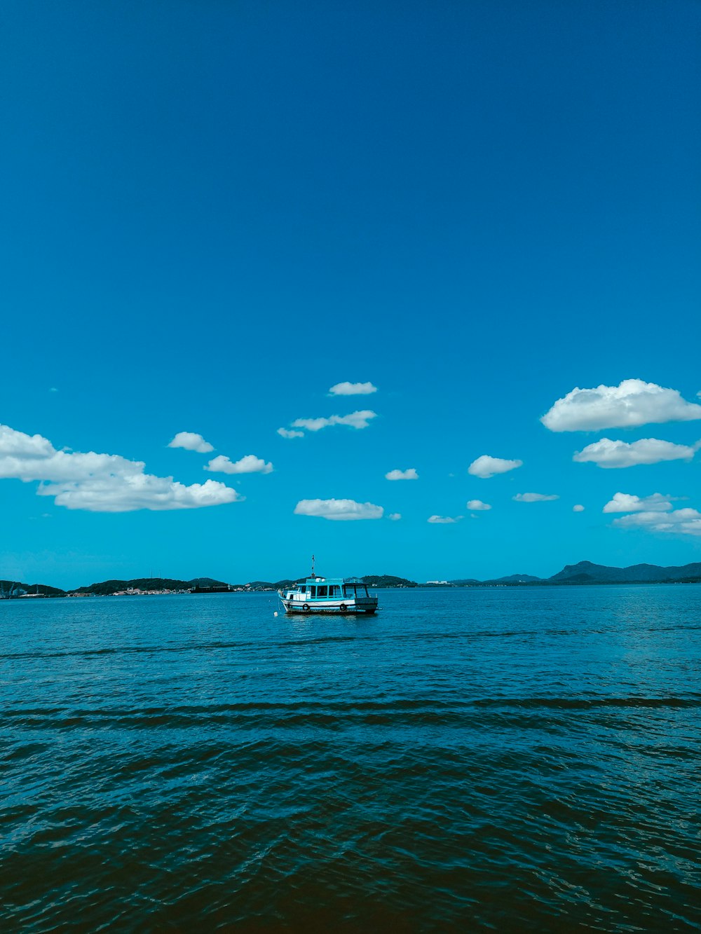 a boat floating on top of a large body of water