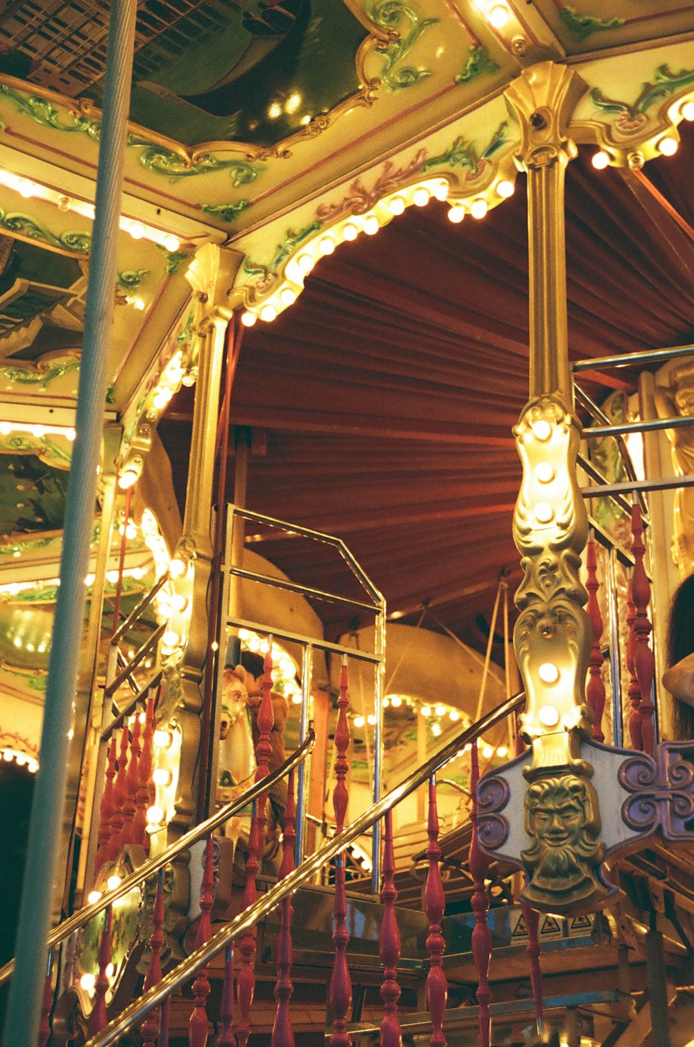 a merry go round with lights and decorations