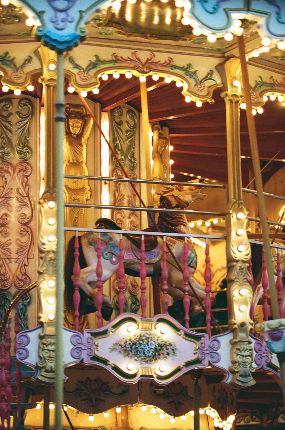 a merry go round with lights and decorations