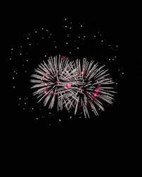 A lively birthday celebration with bright fireworks illuminating the night.