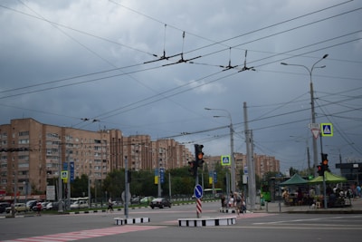 Installation of lighting and signaling systems on a busy street.