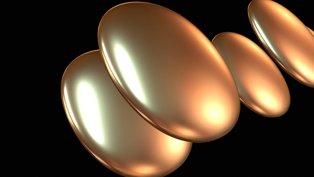 a group of shiny gold circles on a black background