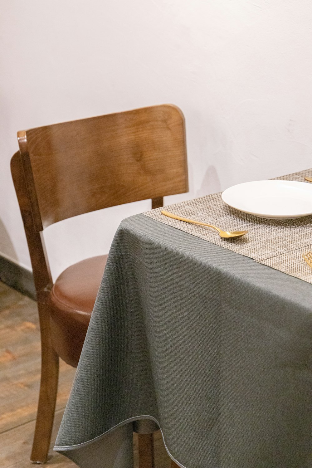 a table with a plate and silverware on it
