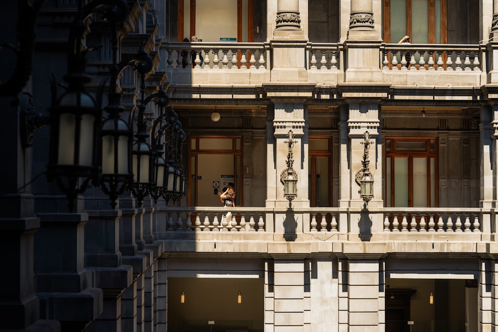 a person standing on a balcony of a building