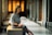 a woman sitting on a bench in a building