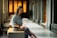 a woman sitting on a bench in a building