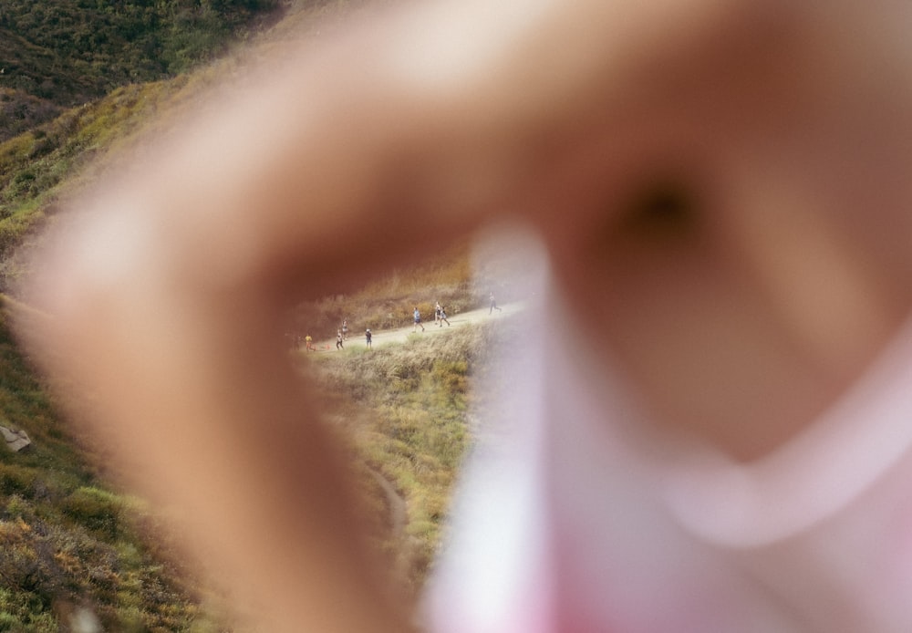 a blurry photo of a person standing on a hill