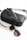 A sleek black leather handbag with a strap lies alongside a pair of tortoiseshell sunglasses. The handbag features the brand name 'Liebeskind Berlin' printed in white on the front.