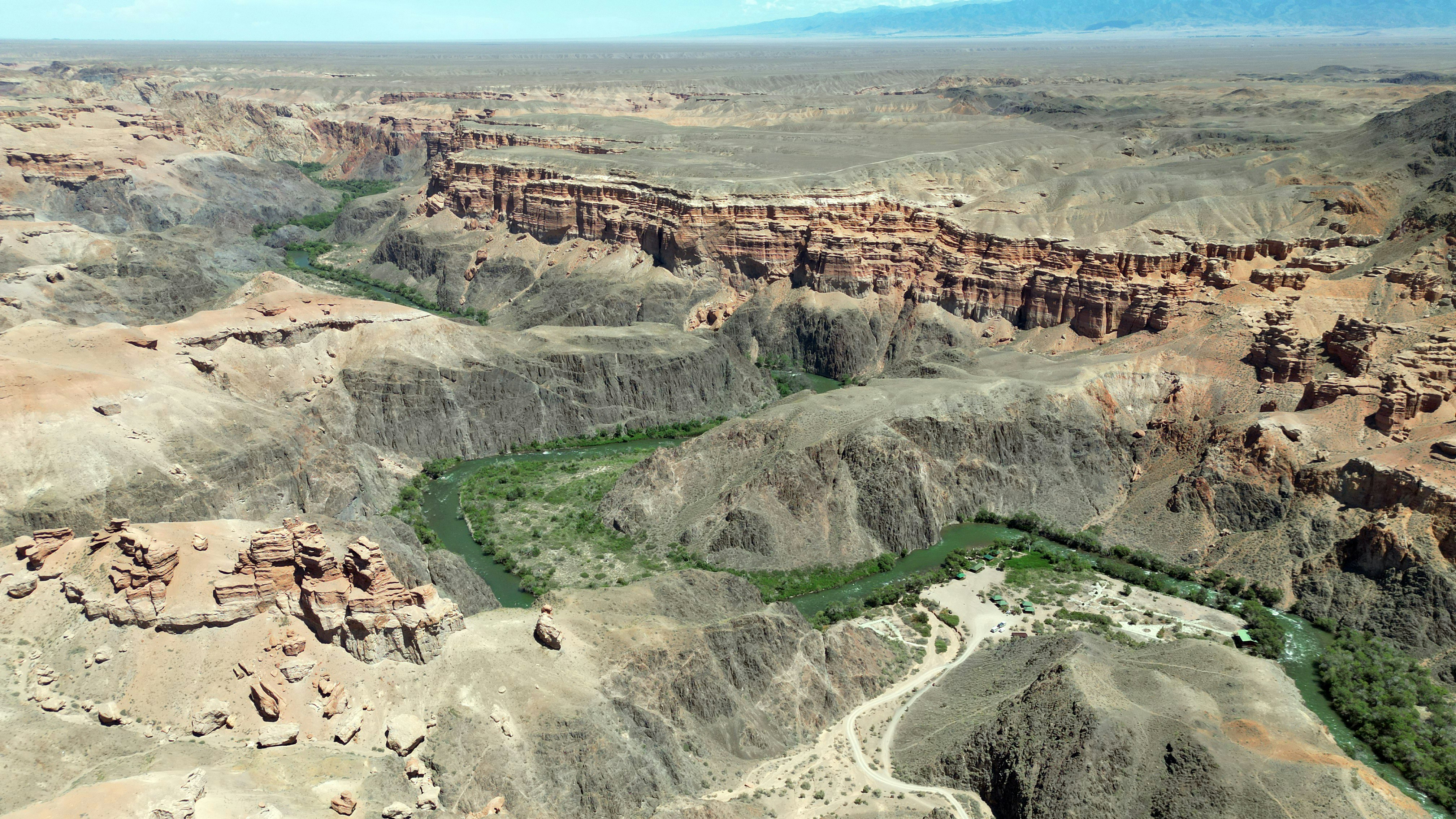 an aerial view of a canyon with a river running through it, 