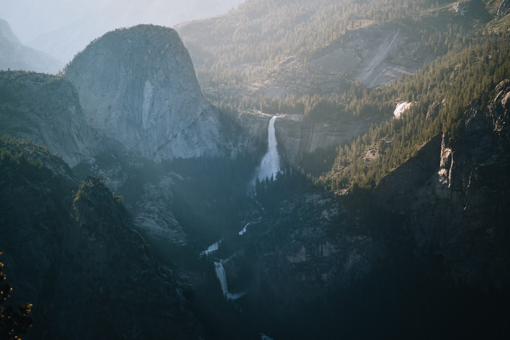 a view of a waterfall in the mountains