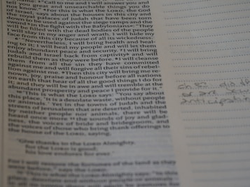 A page of printed text that appears to be from a book, with some handwritten notes in a different section. The text covers biblical themes and appears to be a discussion about a city and its future as mentioned in religious scriptures. The handwriting on the right seems like brief notes or annotations.