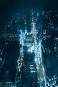 A moody urban night skyline with subtle blue and silver tones reflecting a futuristic sports broadcast vibe.